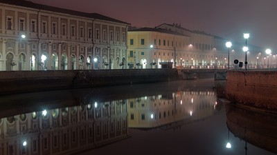 Portici Ercolani reflected in Misa river at night