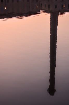 Chimney reflected at harbor