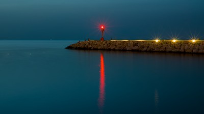 Red lighthouse at night