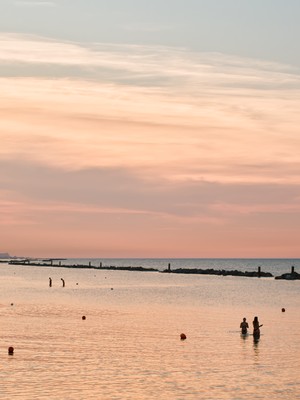 Sea bathing at sunset