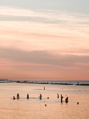 Sea bathing at sunset