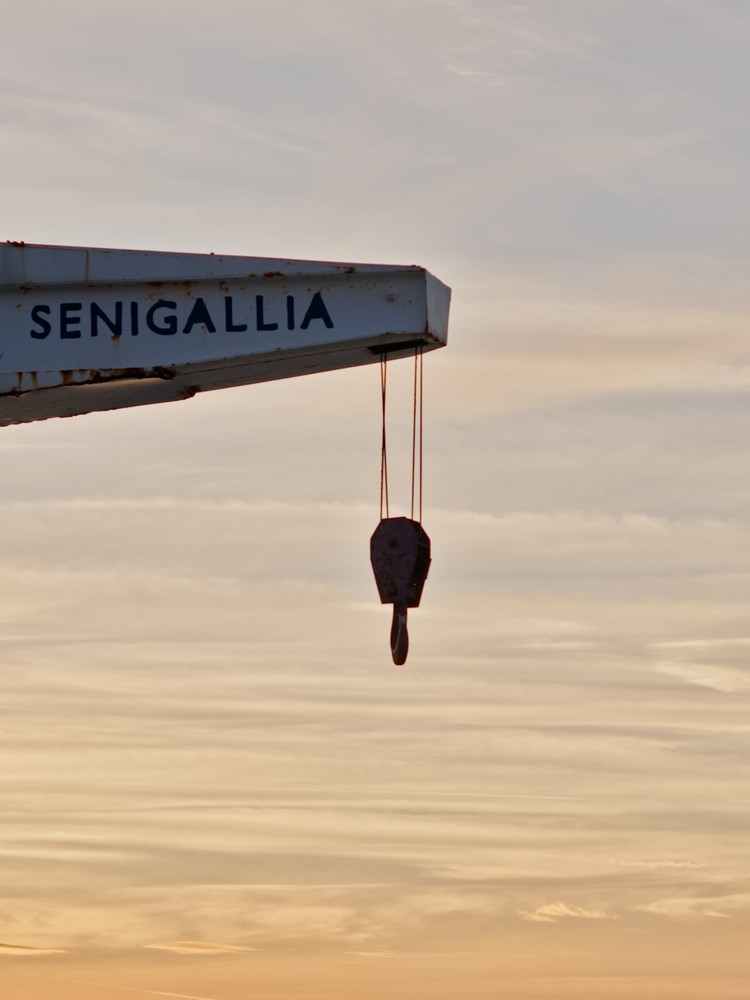 Harbor crane at sunset