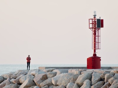 Red lighthouse and woman