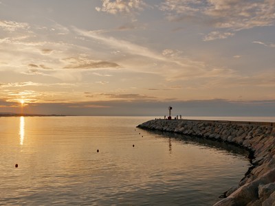 Sunset at the harbor entrance