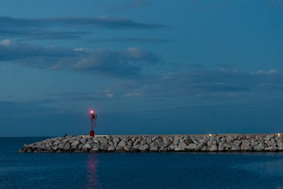 Watching the sea at the red lighthouse