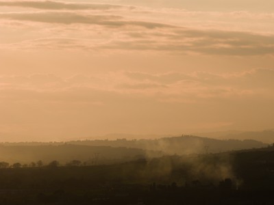 Sunset on the hills through the haze