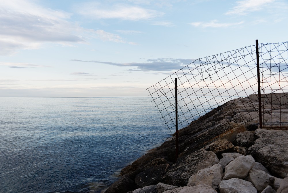 Sea rocks and grid
