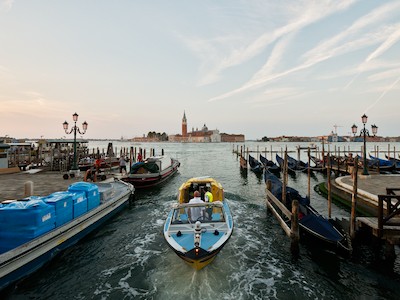 Passing boat at sunrise, with San Giorgio Maggiore church in the background