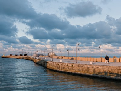 Walking at the harbor at sunset