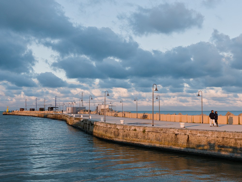 Walking at the harbor at sunset