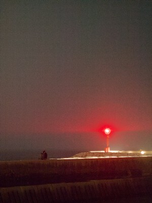 Red lighthouse at night