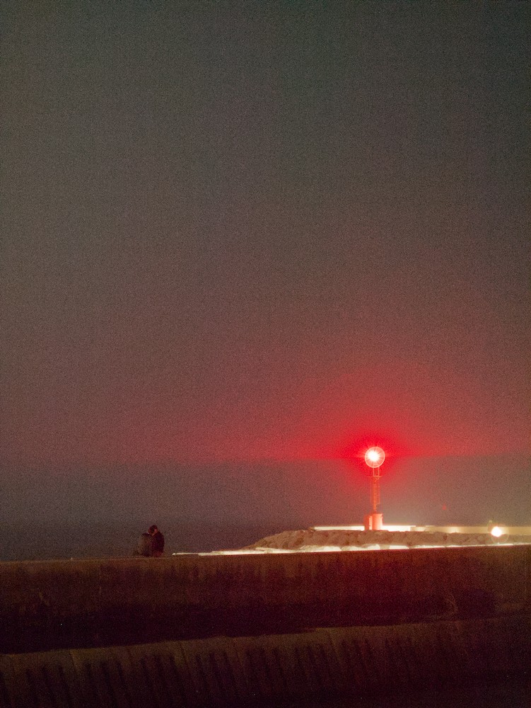 Red lighthouse at night