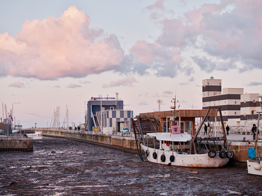 Harbor with marine debris at dusk
