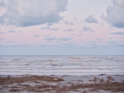 Marine debris on the beach at dusk