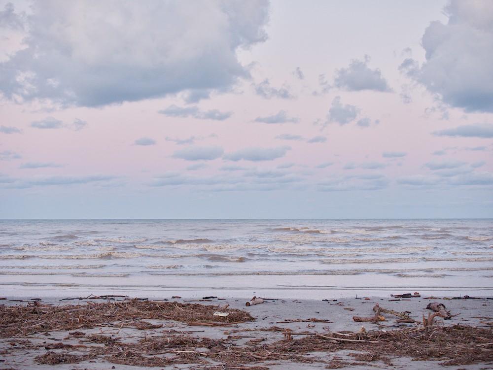Marine debris on the beach at dusk