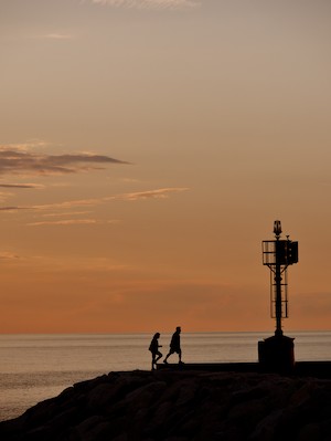 Walking at the harbor at sunset
