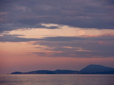 Moon over Mount Conero at dusk