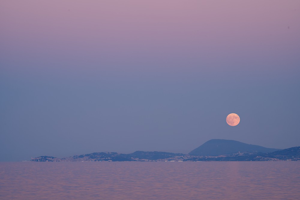 Moon over Mount Conero at dusk