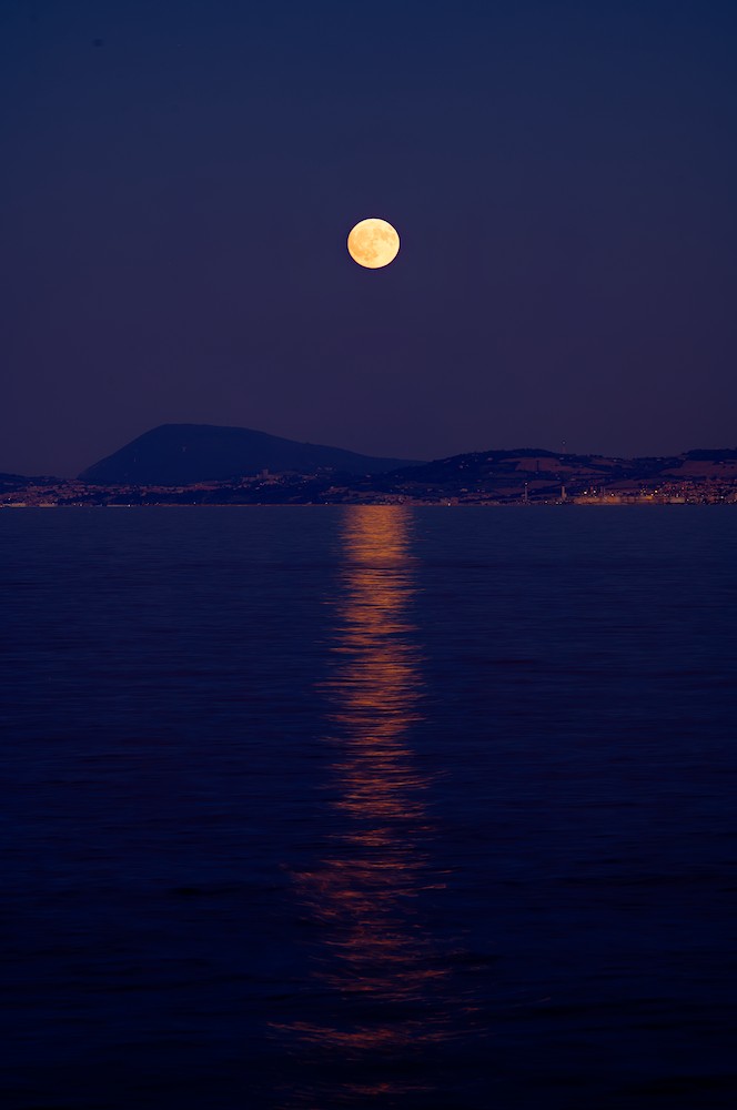 Moon over Mount Conero at dusk
