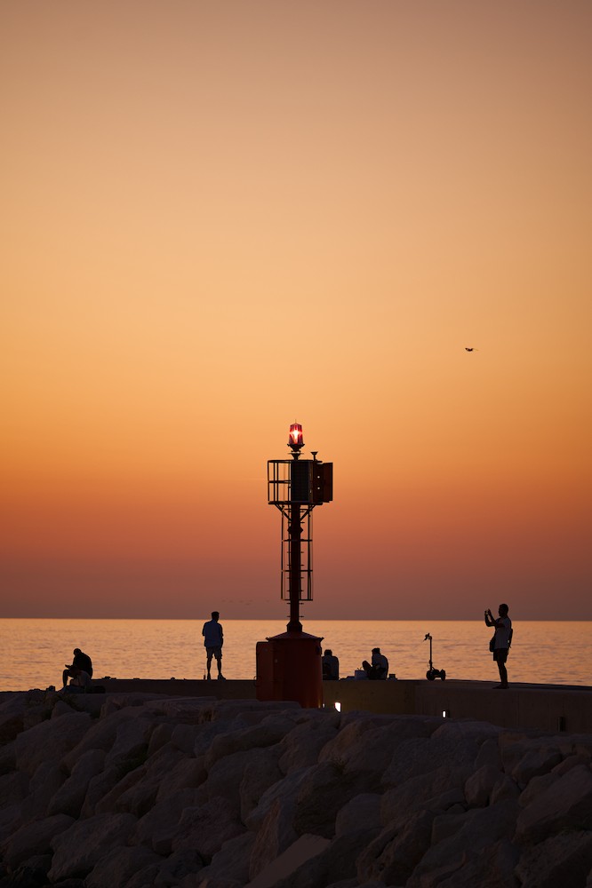Photographing at the harbor at sunset