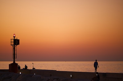Walking at the harbor at sunset