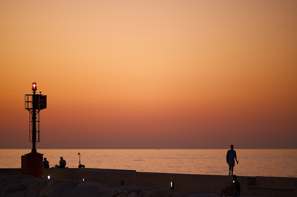 Walking at the harbor at sunset