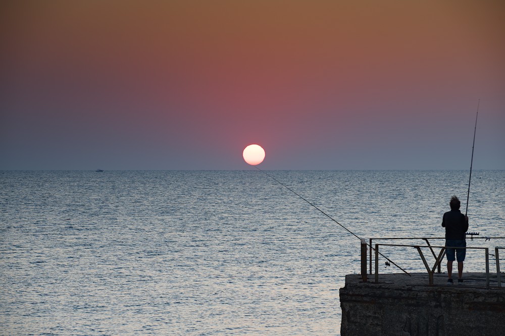 Fishing at sunrise